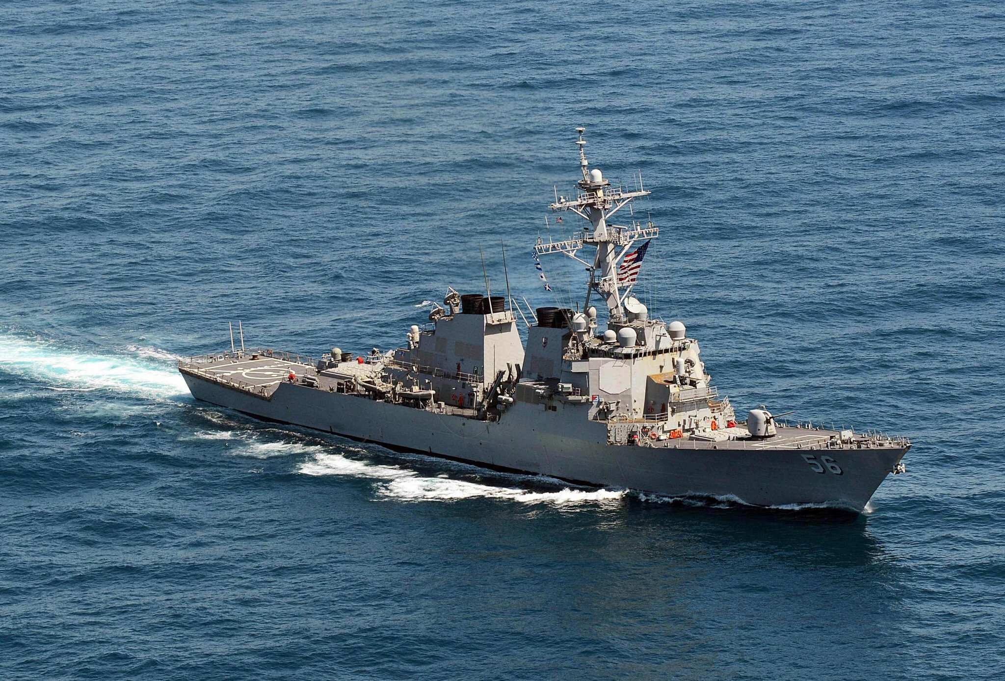 Beijing warns off a US warship sailing near contested islands in South China Sea Beijing warns off a US warship sailing near contested islands in South China Sea