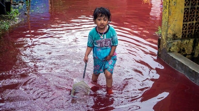 Indonesian village turns red as floods hit batik-manufacturing hub