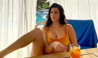 Kourtney Kardashian photoshopped herself into Kim's SKIMS lingerie photoshoot
