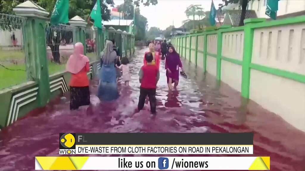 Flood-water in Indonesian village turns red after hit by local batik factory
