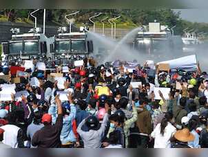 Myanmar police fire water cannon at demonstrators in anti-military protests