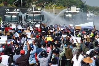 Myanmar police fire water cannon at demonstrators in anti-military protests