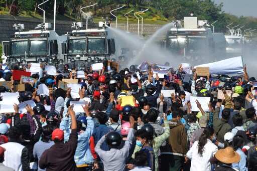 Myanmar police fire water cannon at demonstrators in anti-military protests