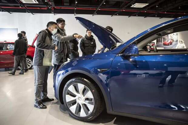 World Business Watch: Tesla faces China regulators over consumer complaints