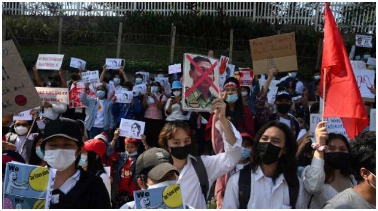 Myanmar protests: Woman shot at as police open fire on demonstrators Myanmar protests: Woman shot at as police open fire on demonstrators