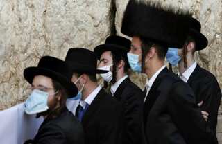 Hundreds of hardline Haredim protest coronavirus enforcement in Jerusalem