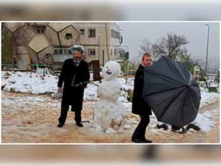 In pictures: Jerusalem experiences rare snowfall