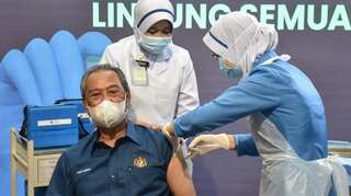 Malaysia launches COVID-19 vaccination drive as PM gets first shot