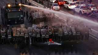 Thai protesters, police clash near base of army unit king controls