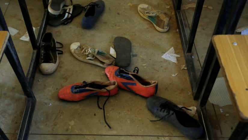 Parents wait and pray for more than 300 kidnapped schoolgirls