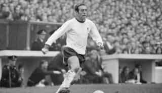 Former Liverpool great St John dies aged 82