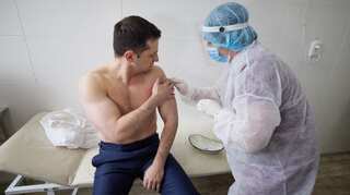 Ukraine's Zelensky receives coronavirus vaccine in war-torn east, urges others to follow suit