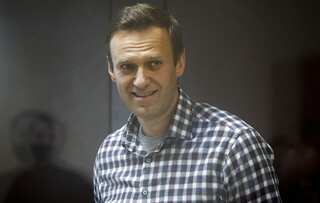 Kremlin critic Navalny says he risks solitary confinement over infractions