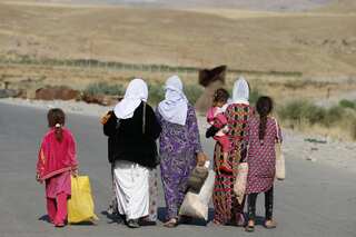 Syria Kurds hand 12 children to their Iraqi Yazidi mothers