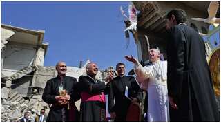 Pope Francis prays for 'victims of war' in Mosul, a former Islamic State stronghold in Iraq