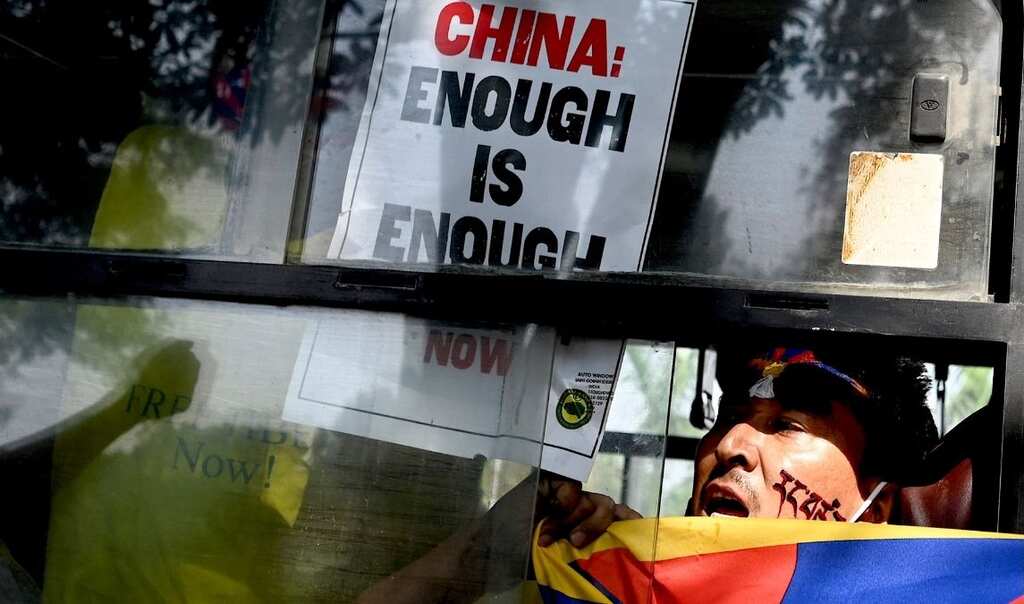 Exiled Tibetans in India protest the demolition of Buddha statue in Tibet