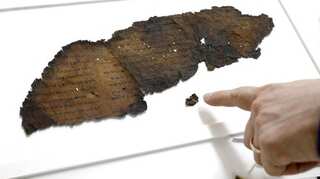 Scientists unearth fragments of 2,000-year-old biblical scroll