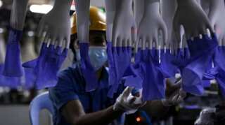 Malaysia charges Top Glove over quality of worker housing