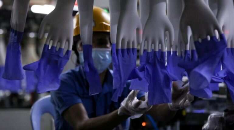 Malaysia charges Top Glove over quality of worker housing