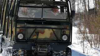 Putin pilots bumpy all-terrain rig on Siberian holiday 