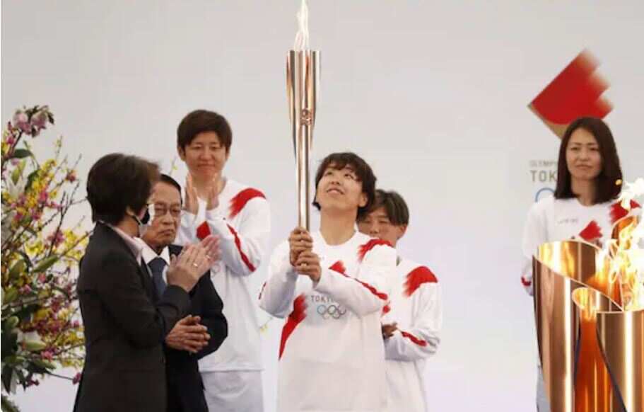Olympics torch relay starts in Fukushima as North Korea launches missiles
