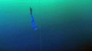The deepest diver in the history of free diving goes below the ice