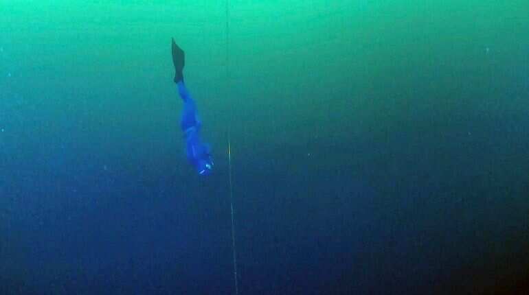 The deepest diver in the history of free diving goes below the ice