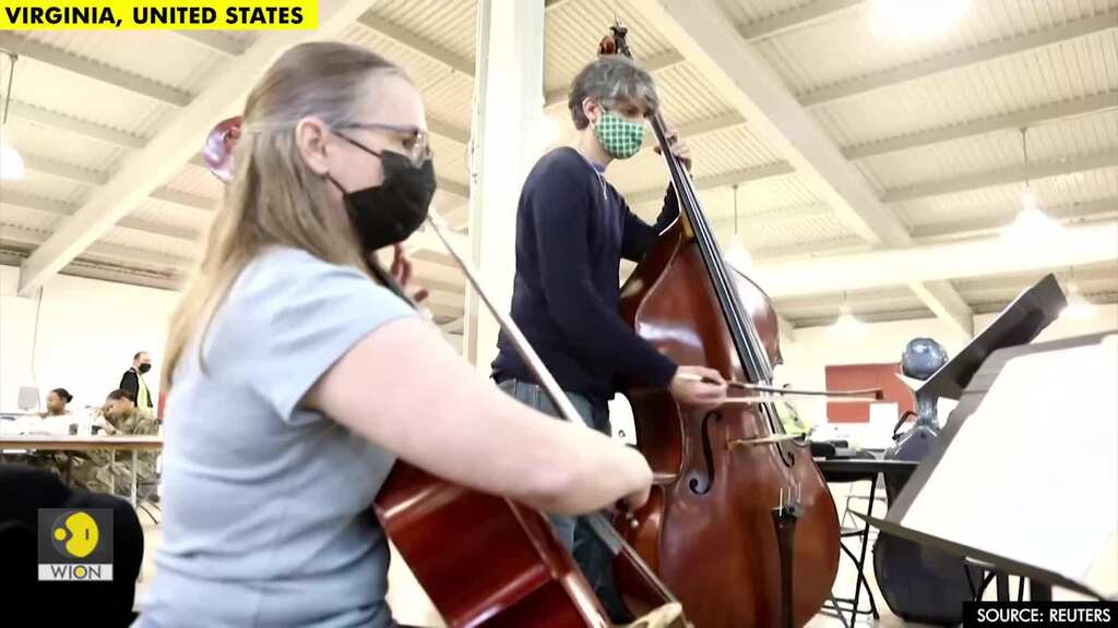 Classical duo injects music into coronavirus vaccination site