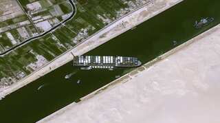 Suez Canal shipping backlog ends, days after giant vessel freed
