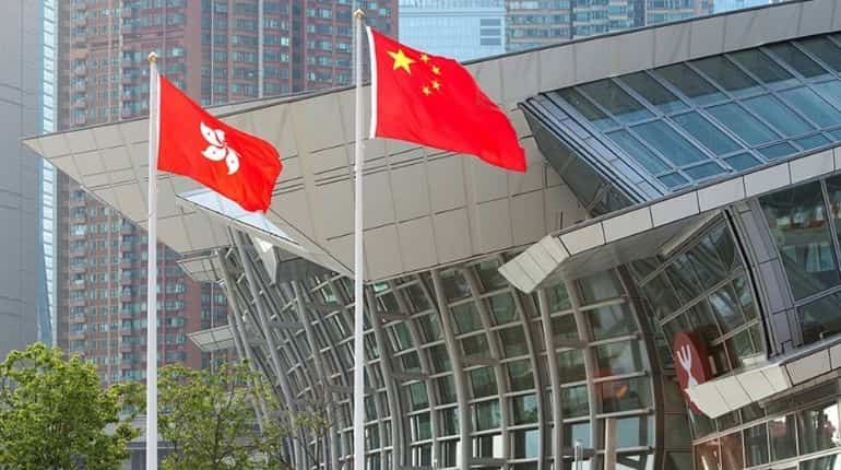 China sharply reduces elected seats in Hong Kong legislature to 20 from 35 