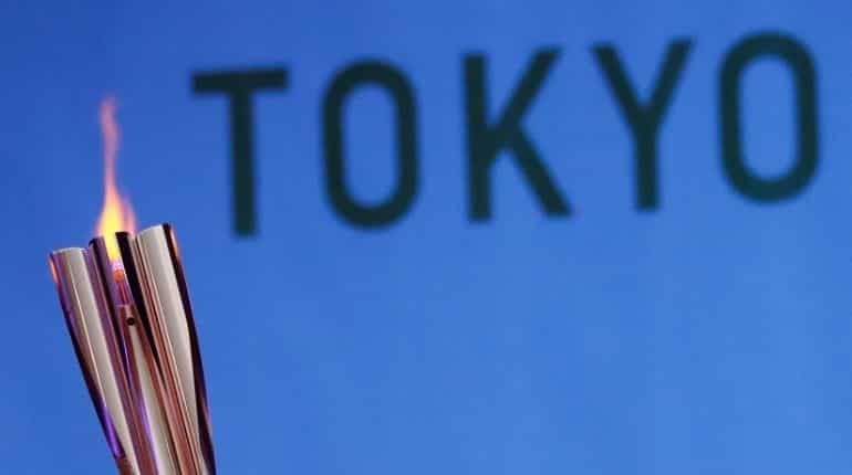 Nagano bars fans from parts of torch relay as COVID precaution