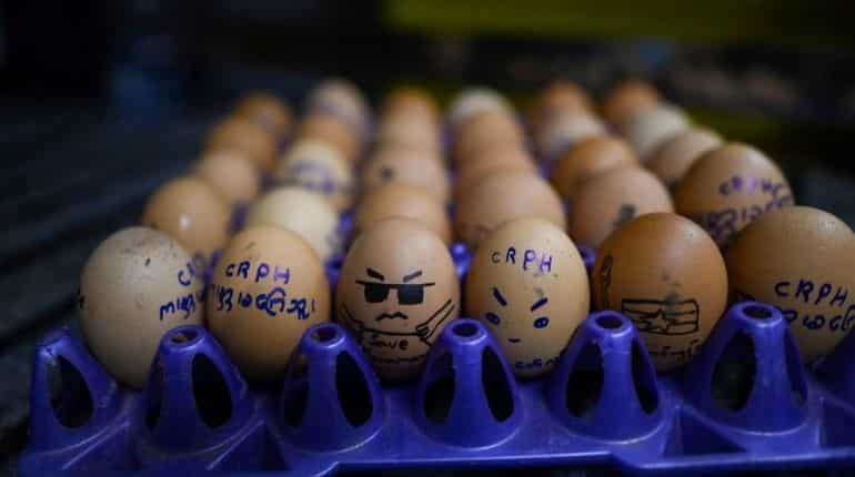 Art for freedom: Myanmar locals decorate Easter eggs with political messages, World News ...