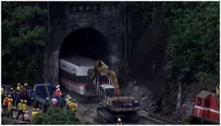 Damaged carriage dragged from Taiwan train disaster tunnel