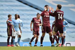 Dallas double sees 10-man Leeds shock Man City
