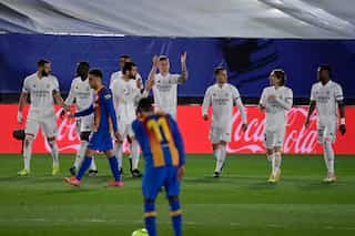 Real Madrid edge thrilling Clasico to go top of La Liga