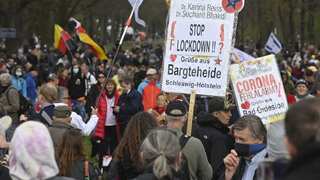 Police clash with protesters as Germany passes virus law 