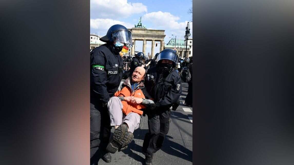 Protesters dragged