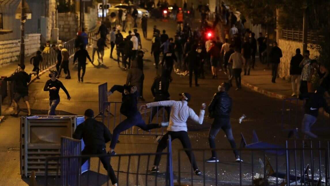 Stones and water cannons