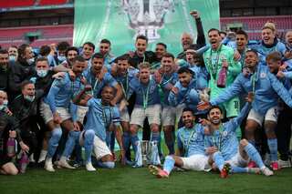 Man City outclass Tottenham to retain League Cup in front of 8,000 fans