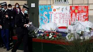 French citizens, imams and police pay tribute to slain police worker