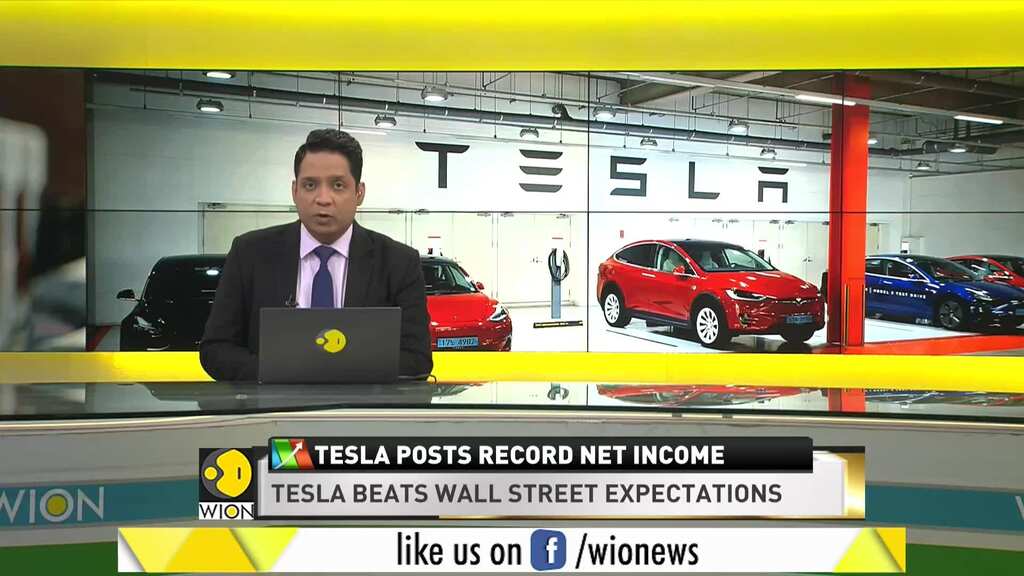 World Business Watch: Tesla posts record net income, revenue surges by 74%