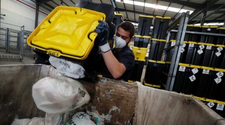 COVID-19 vaccine rollout keeps waste workers busy, environmentalists worried