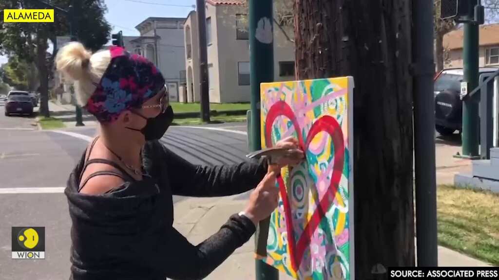 Artist spreads love, smiles through "heartwork"