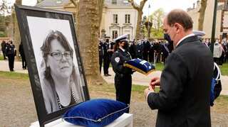 France pays tribute to woman police worker stabbed to death in Islamist-inspired attack