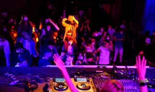 Euphoric clubbers hit dance floor again as Spain trials digital COVID-19 pass