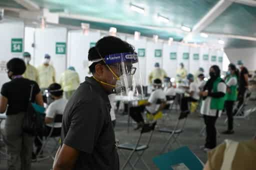 Woman dies due to COVID-19 in Singapore as new cases emerge