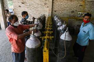 Experts make dire projections amid second Covid wave as India faces medical shortages