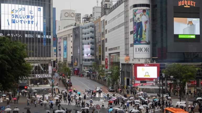 Covid cases in Tokyo at record high as government expands restrictions