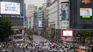 Covid cases in Tokyo at record high as government expands restrictions