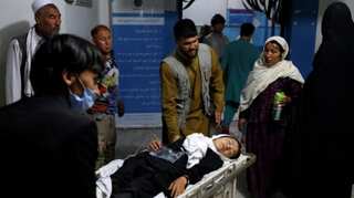 Afghan school blast toll rises to 58, families bury victims